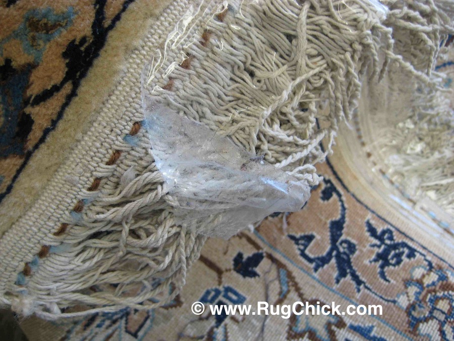 Clear packing tape on rug fringe