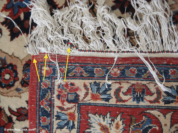 The decorative braid is sliding away from this Persian rug