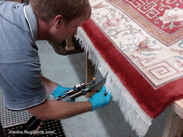 Adhesive glue for fabric borders on back of tufted rugs