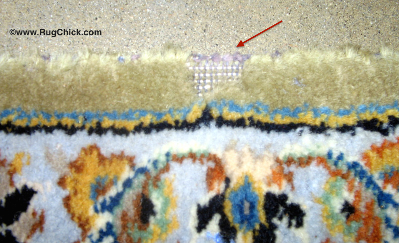 Carpet beetles ate away the wool in this area and left behind only the cotton foundation fibers (grey and white).