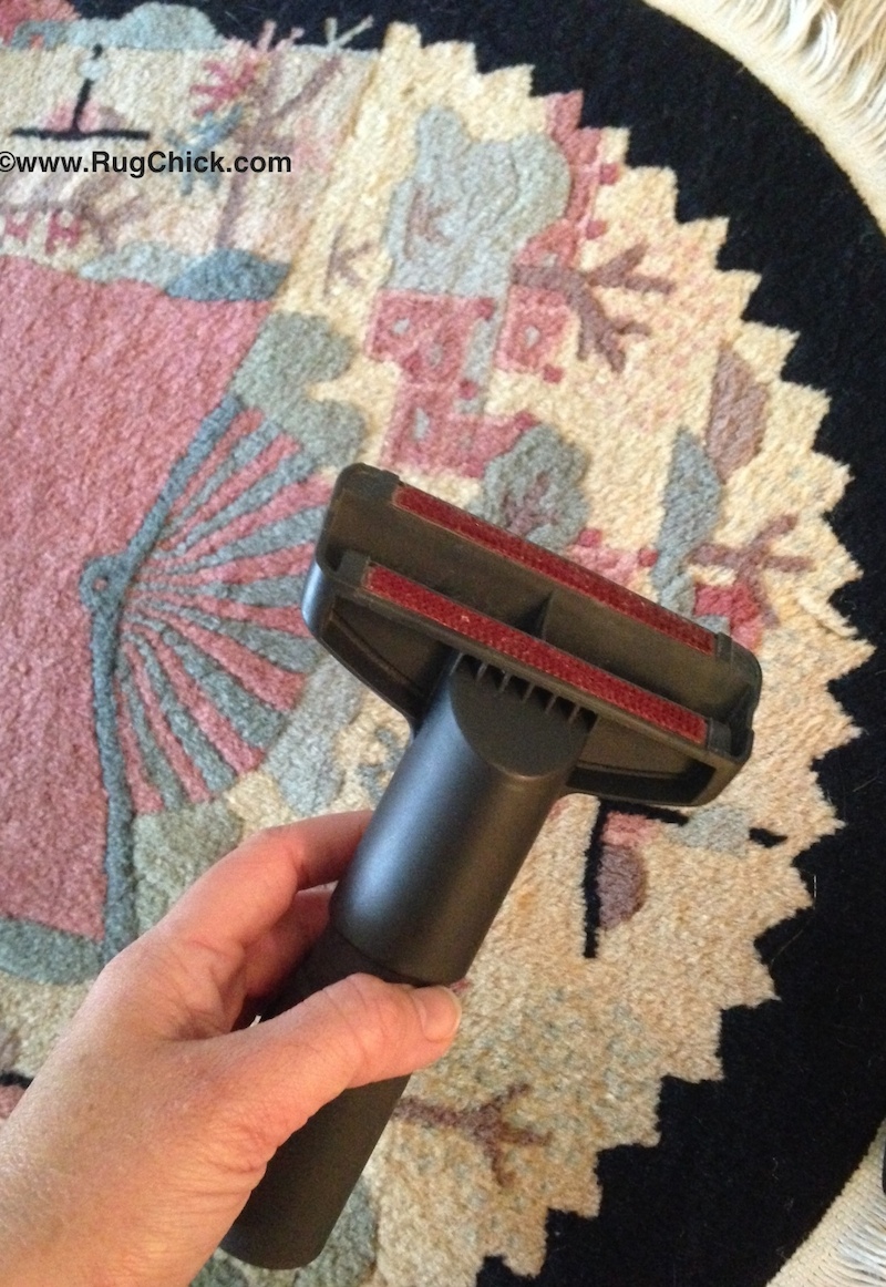Use the upholstery tool on your vacuum to dust thinner woven rugs.