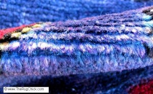 Purple ink on blue rug