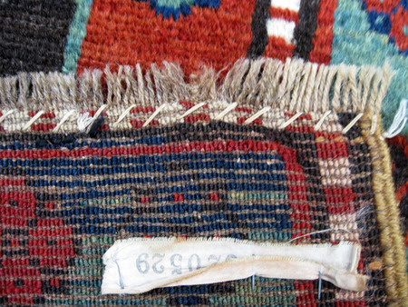 Darning the end of a rug