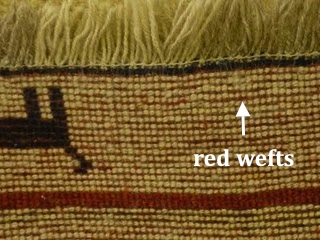 Red wefts on a Gabbeh rug