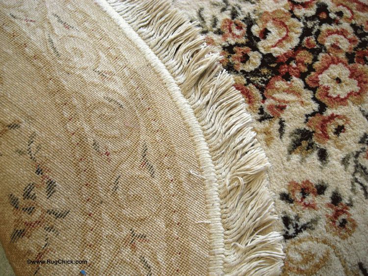 Back and front views of a synthetic rug