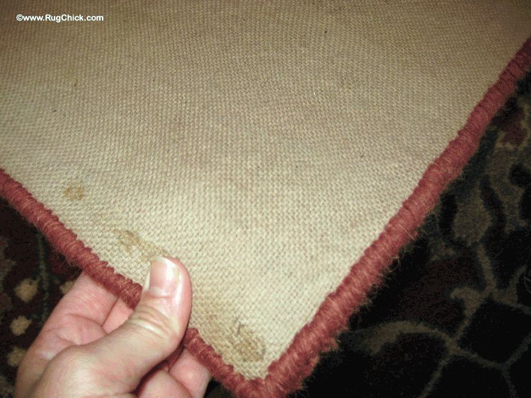Tufted rug. The material is covering up latex, and it smells.