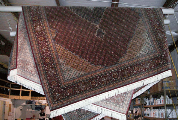 Hang rugs at an angle to lessen potential creasing.