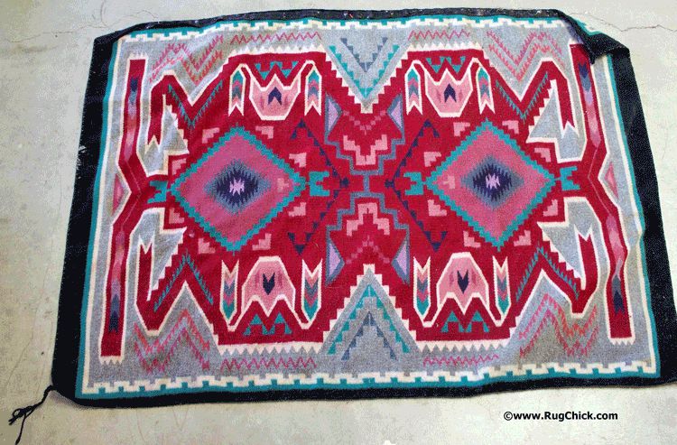 Navajo rug from a flood, the outside cords have shrunk creating a buckling of the rug.