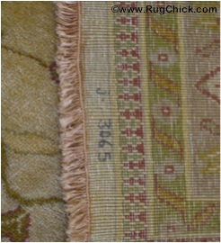 Tea washed rug has beige fringe that is “blotchy.”