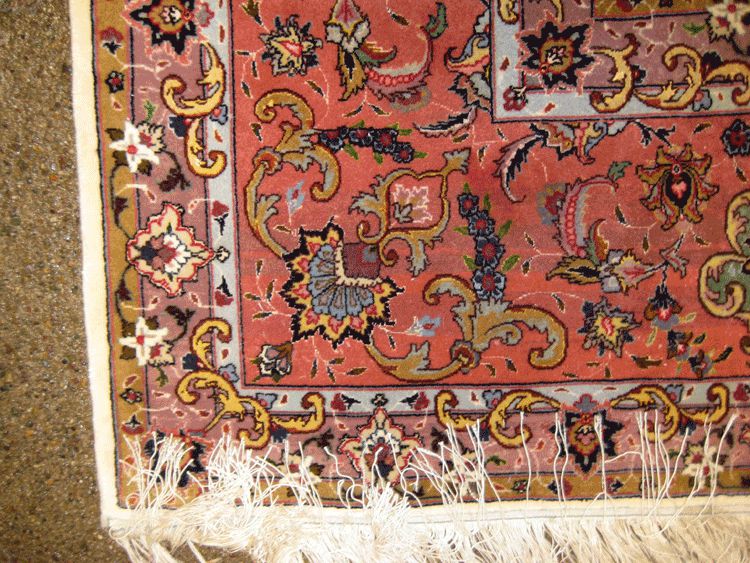 Tabriz hand woven wool rug.