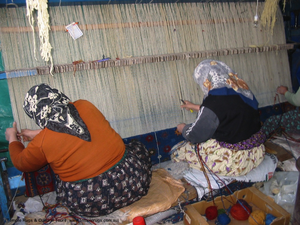 Photo by Temple Rugs & Cultural Tours, used with permission. 3 DOBAG weavers crafting a Turkish rug by hand.  www.templerugs.com.au