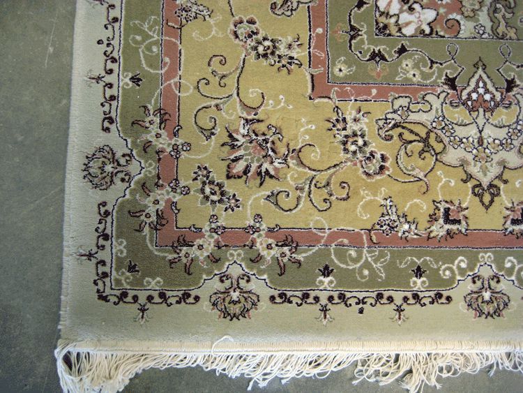 Acrylic machine made Tabriz design rug.