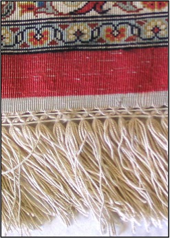 Quality silk rugs have a high knot count, vibrant colors, and a thin pile.