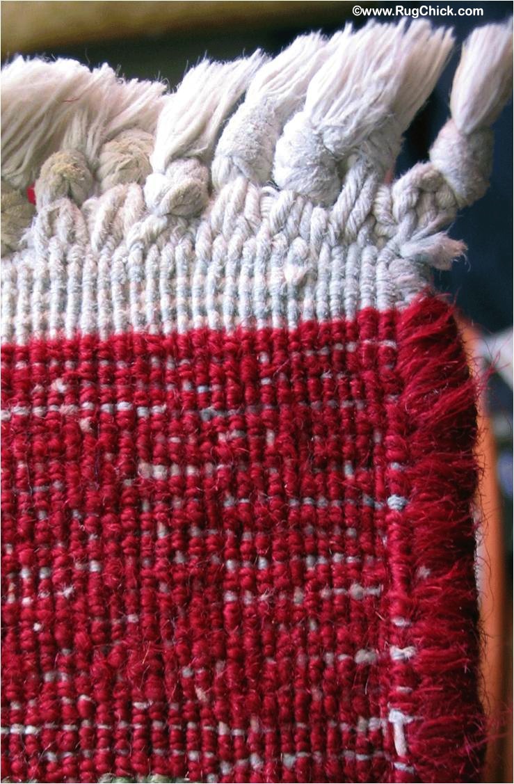 Hand woven rug – wool fibers are wrapped around the warps. Those cotton strands running vertically make up the fringe tassels.